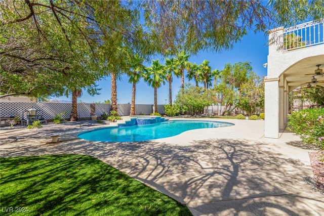 view of swimming pool featuring a patio, ceiling fan, and an in ground hot tub