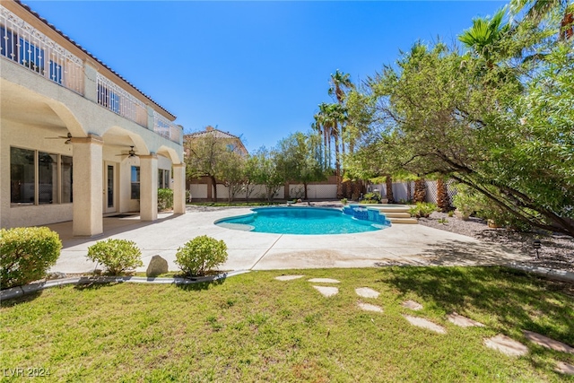 view of pool featuring ceiling fan, a yard, and a patio