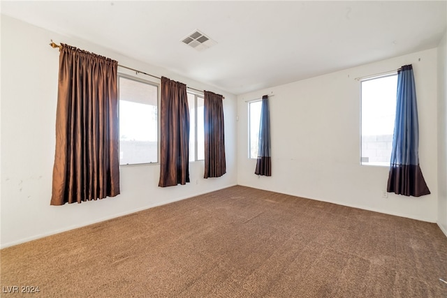 unfurnished room with carpet floors