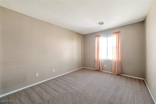 empty room featuring carpet floors