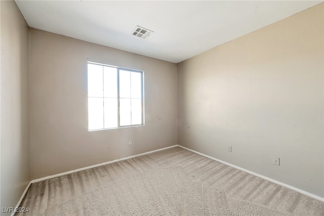 unfurnished room featuring carpet floors