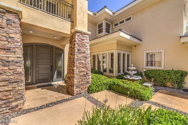 doorway to property featuring a balcony