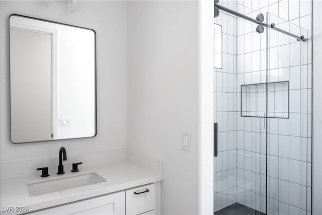 bathroom with vanity and an enclosed shower