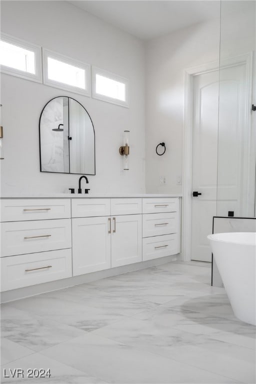 bathroom featuring vanity and a bathing tub