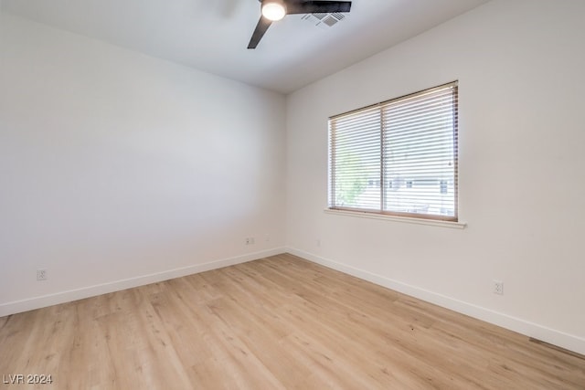 empty room featuring ceiling fan and light wood-type flooring