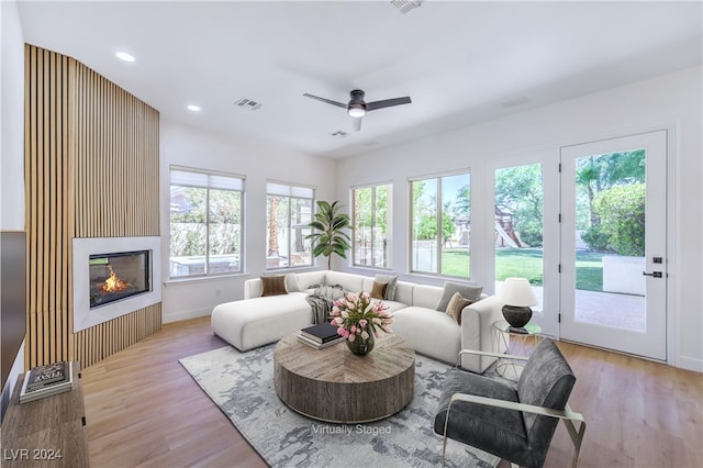 sunroom featuring ceiling fan