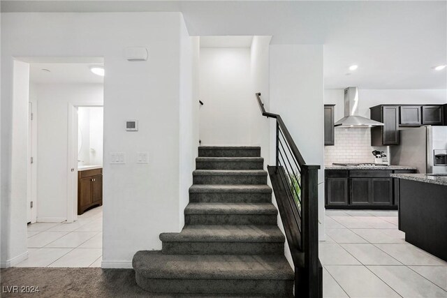 stairs with tile patterned flooring