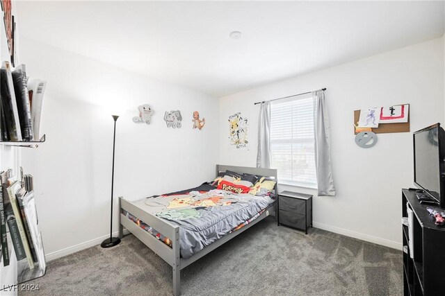 bedroom featuring light colored carpet