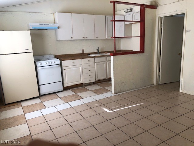 kitchen with white cabinetry, white appliances, and sink