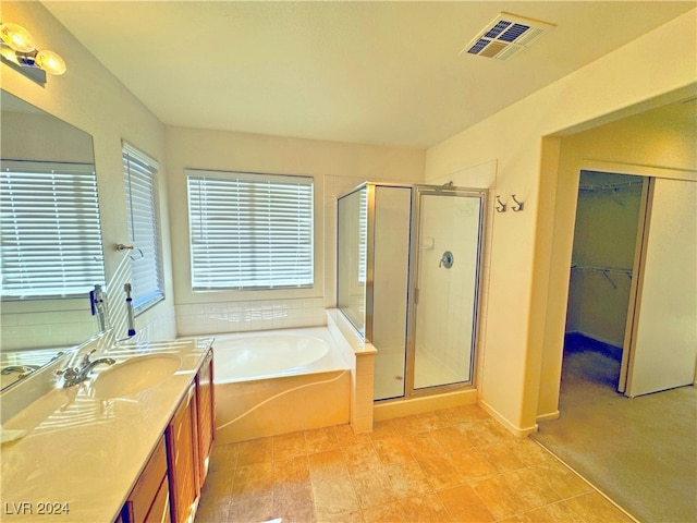 bathroom with vanity and plus walk in shower