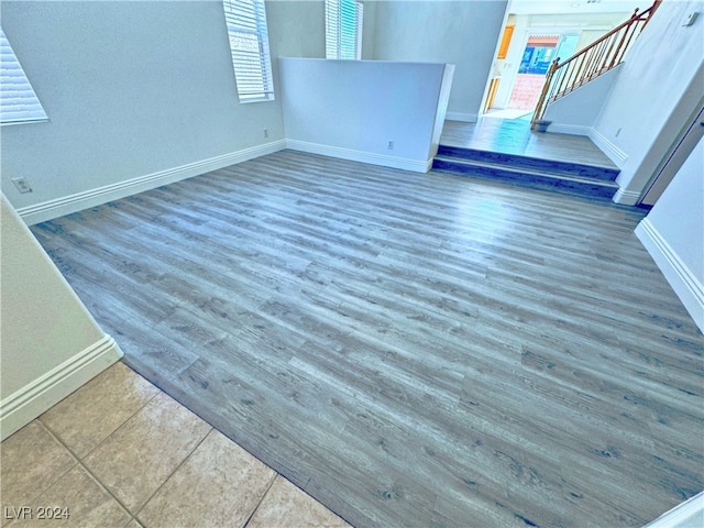 unfurnished living room featuring dark hardwood / wood-style floors