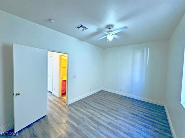 empty room featuring hardwood / wood-style floors and ceiling fan