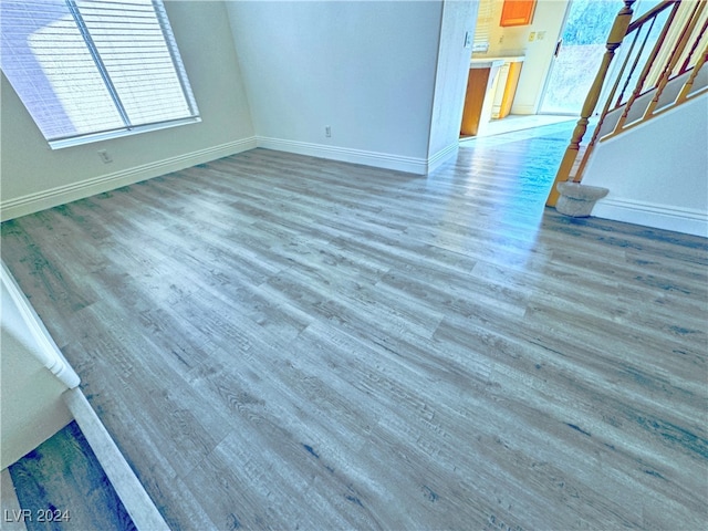 unfurnished living room with hardwood / wood-style flooring