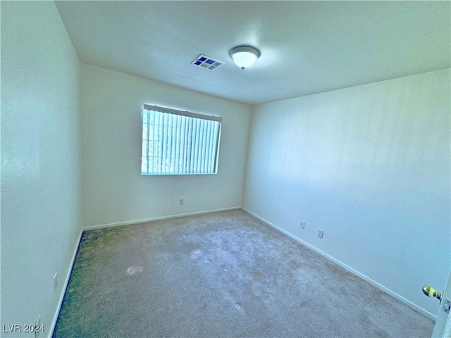 unfurnished room with carpet