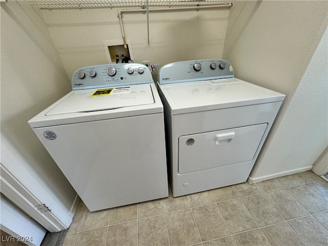 laundry area with washing machine and clothes dryer