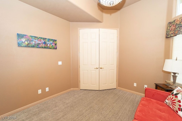 sitting room featuring carpet flooring