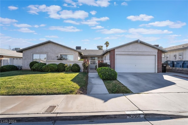 ranch-style home with a garage and a front lawn