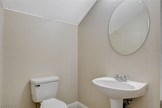 bathroom with sink and toilet