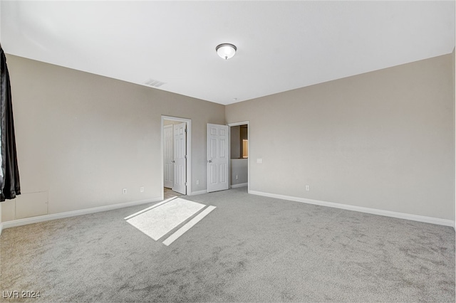 unfurnished bedroom with light colored carpet