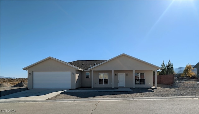 single story home featuring a garage