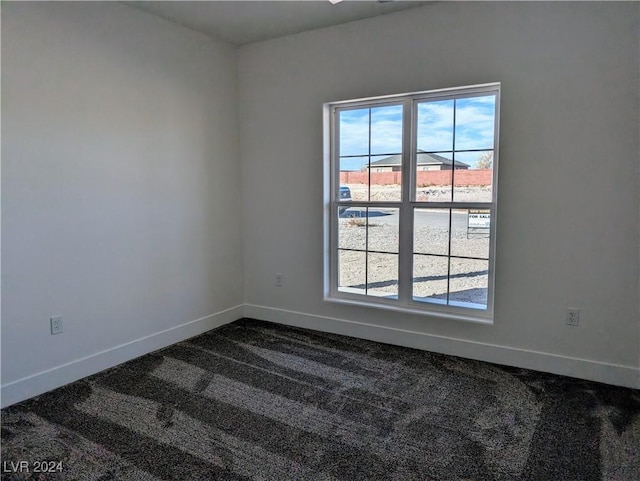 carpeted empty room featuring a healthy amount of sunlight