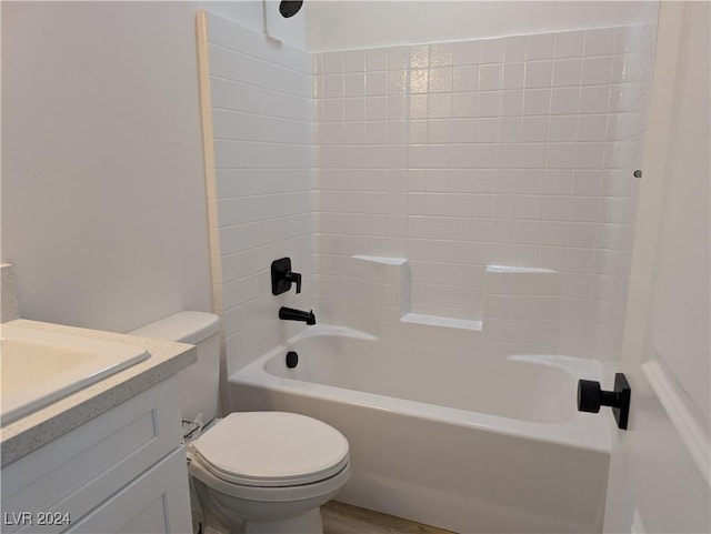 full bathroom featuring wood-type flooring, bathtub / shower combination, toilet, and vanity