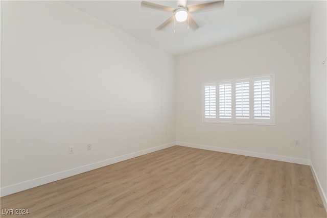 spare room featuring light wood-type flooring and ceiling fan