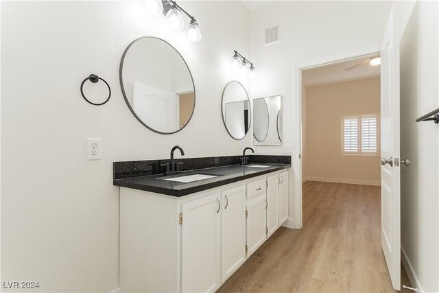 700 Carnegie St Unit 2312, Henderson, NV 89052 - bathroom with wood finished floors, double vanity, and baseboards