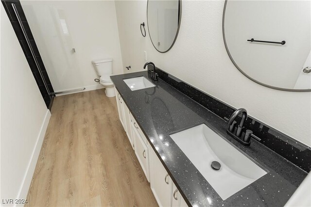 700 Carnegie St Unit 2312, Henderson, NV 89052 - bathroom with toilet, wood finished floors, baseboards, and double vanity