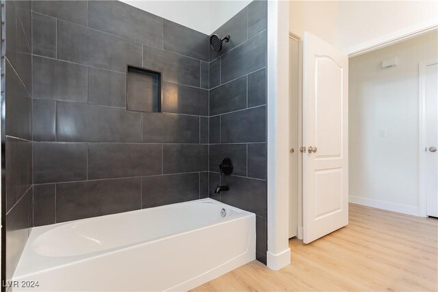 700 Carnegie St Unit 2312, Henderson, NV 89052 - full bathroom featuring wood finished floors, baseboards, and shower / washtub combination