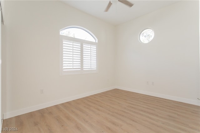 spare room with ceiling fan and light hardwood / wood-style flooring