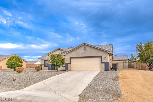 ranch-style house with a garage and cooling unit