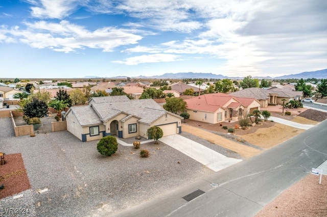 birds eye view of property featuring a mountain view