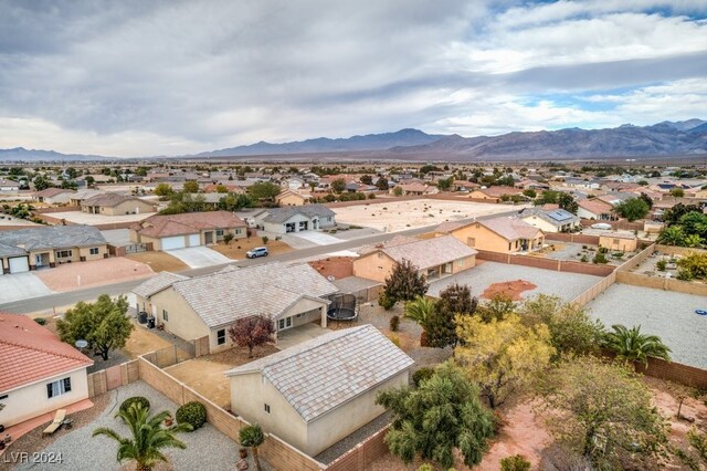 birds eye view of property with a mountain view