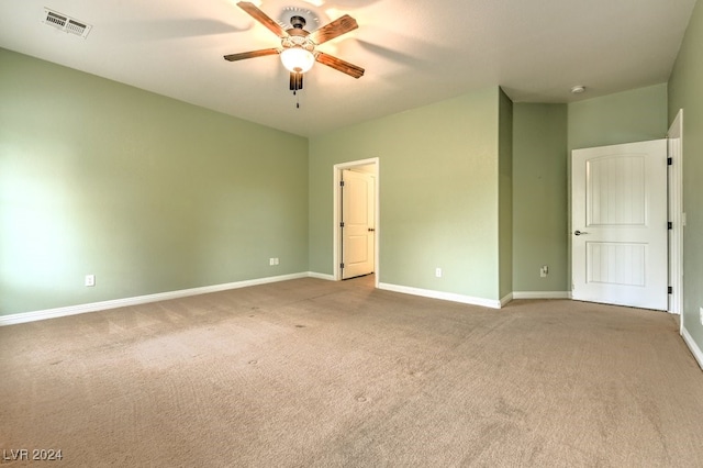 unfurnished bedroom with light colored carpet and ceiling fan