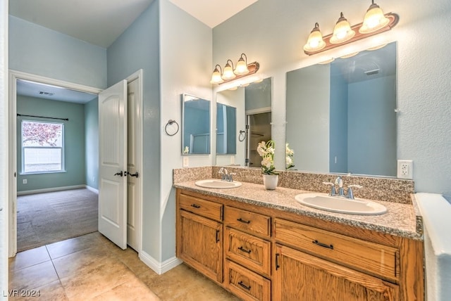 bathroom with vanity and tile patterned floors