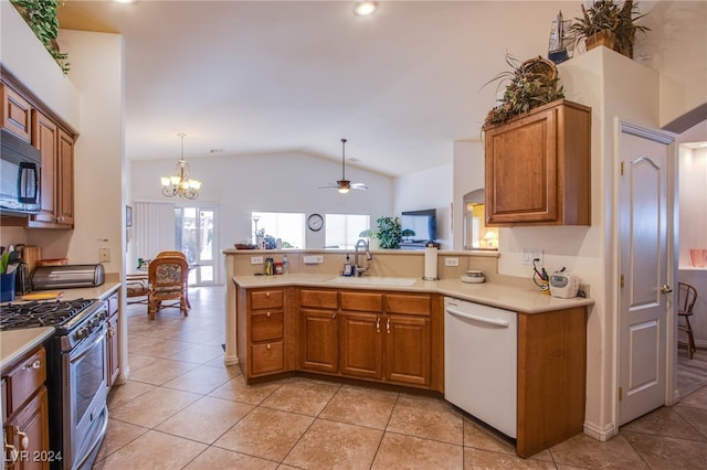 kitchen with stainless steel gas stove, dishwasher, lofted ceiling, sink, and kitchen peninsula