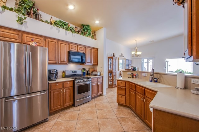 kitchen featuring sink, a chandelier, hanging light fixtures, light tile patterned floors, and appliances with stainless steel finishes