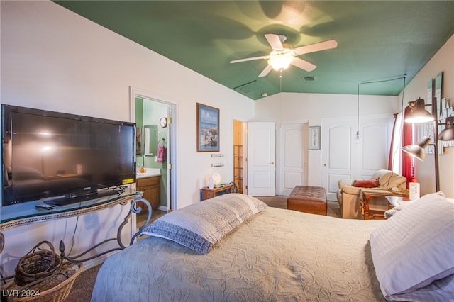 bedroom with vaulted ceiling, ceiling fan, and ensuite bathroom