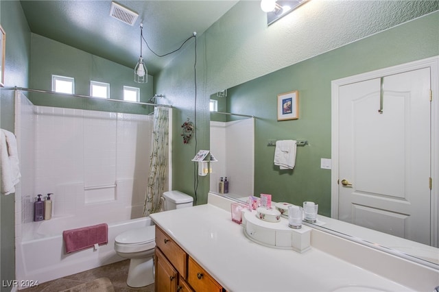 full bathroom featuring vaulted ceiling, shower / bath combination with curtain, vanity, toilet, and a textured ceiling