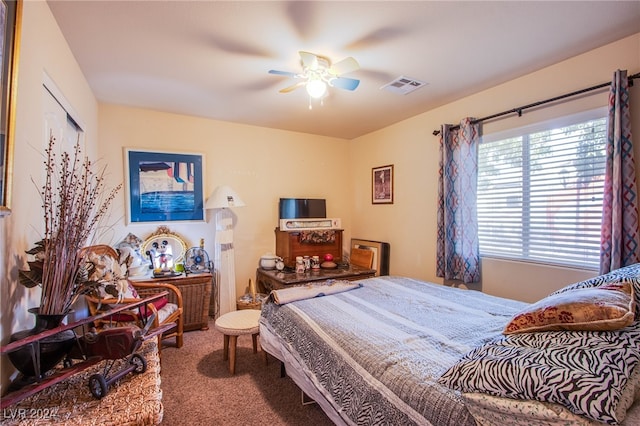 carpeted bedroom featuring ceiling fan