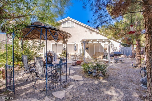 view of patio / terrace featuring a grill and a pergola