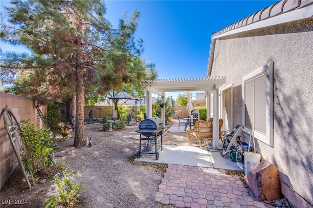 view of patio featuring a gazebo and a pergola