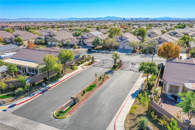 birds eye view of property with a mountain view