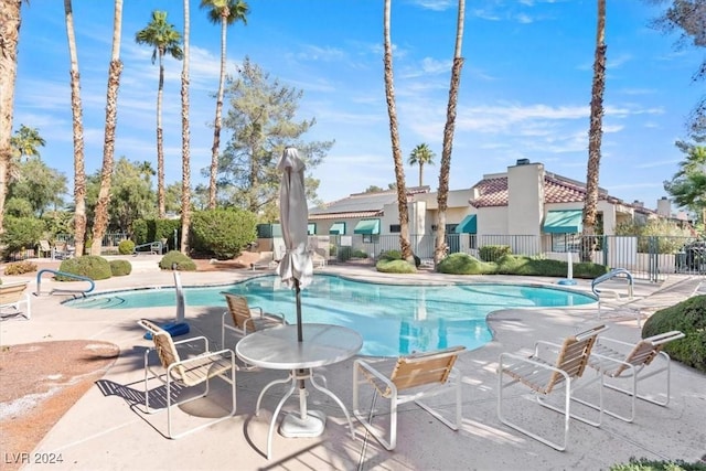 view of swimming pool with a patio