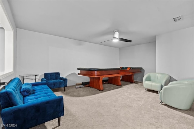 playroom with ceiling fan and light carpet