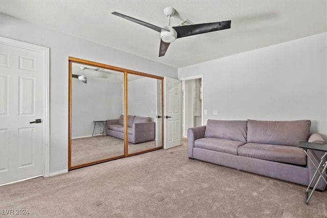 unfurnished living room featuring ceiling fan and light carpet