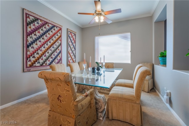 dining room with light tile patterned flooring, a ceiling fan, baseboards, and ornamental molding