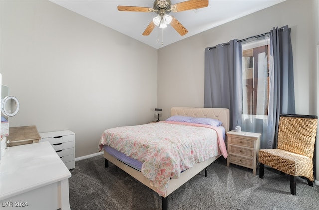 bedroom with a ceiling fan, carpet, and baseboards