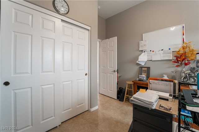 office space with light tile patterned flooring